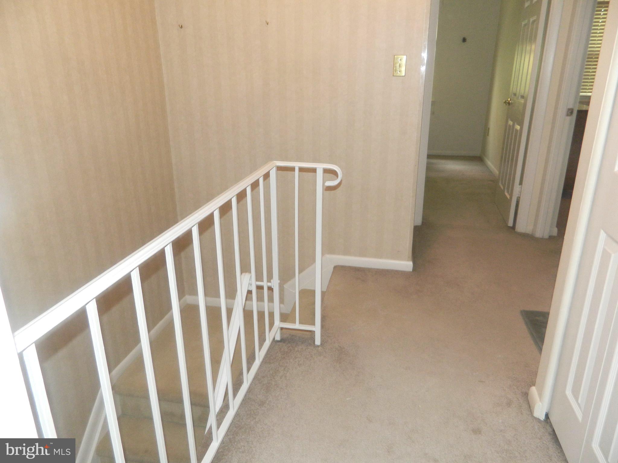 17 Theo Lane, Unit 17 Towson, MD 21204 - Photo 43 of 54 a view of a hallway with staircase