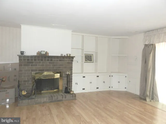 a bathroom with a light fixture and shower curtain