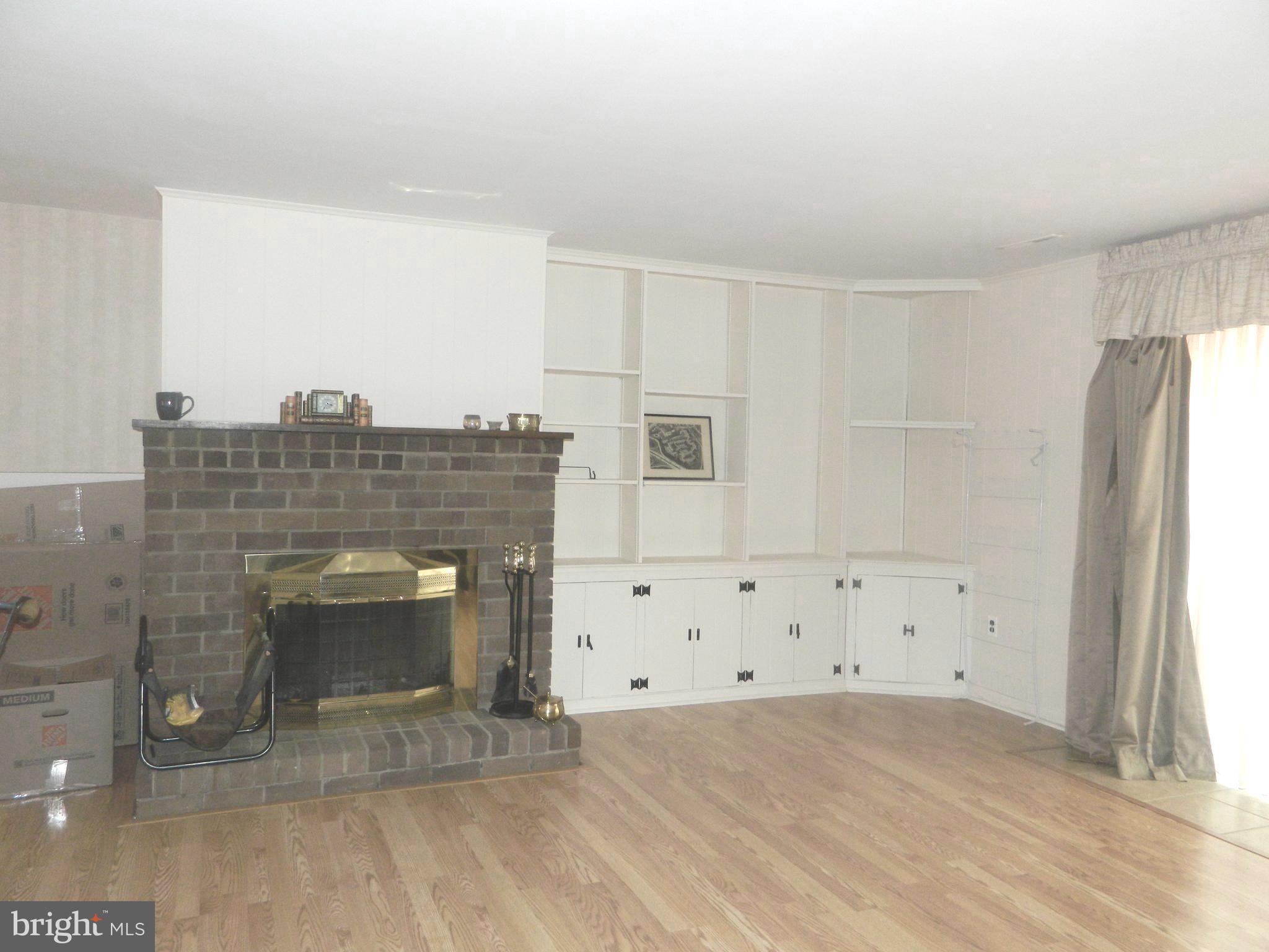 17 Theo Lane, Unit 17 Towson, MD 21204 - Photo 44 of 54 a view of kitchen with cabinets and wooden floor