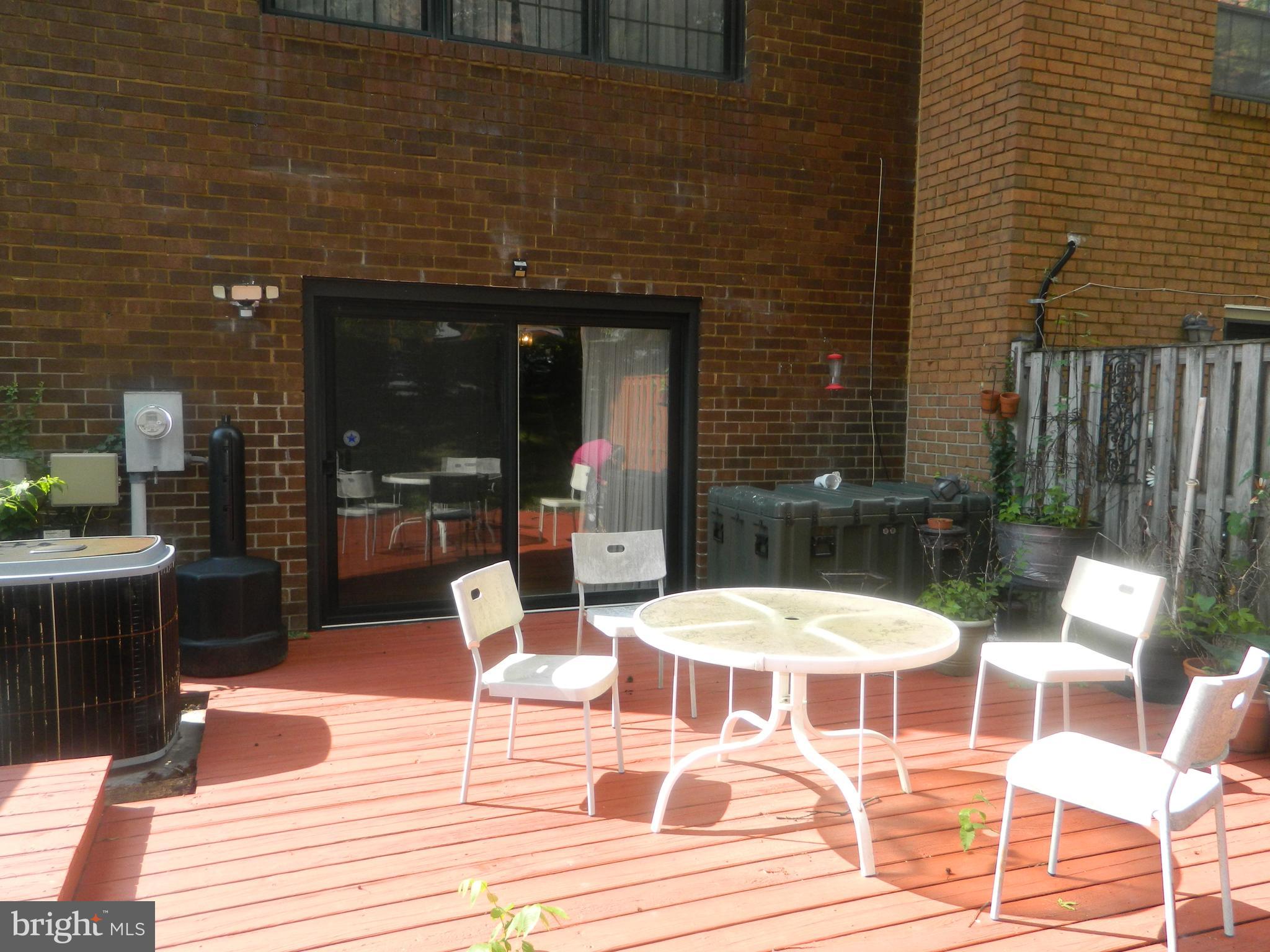 17 Theo Lane, Unit 17 Towson, MD 21204 - Photo 49 of 54 a patio with a table and chairs