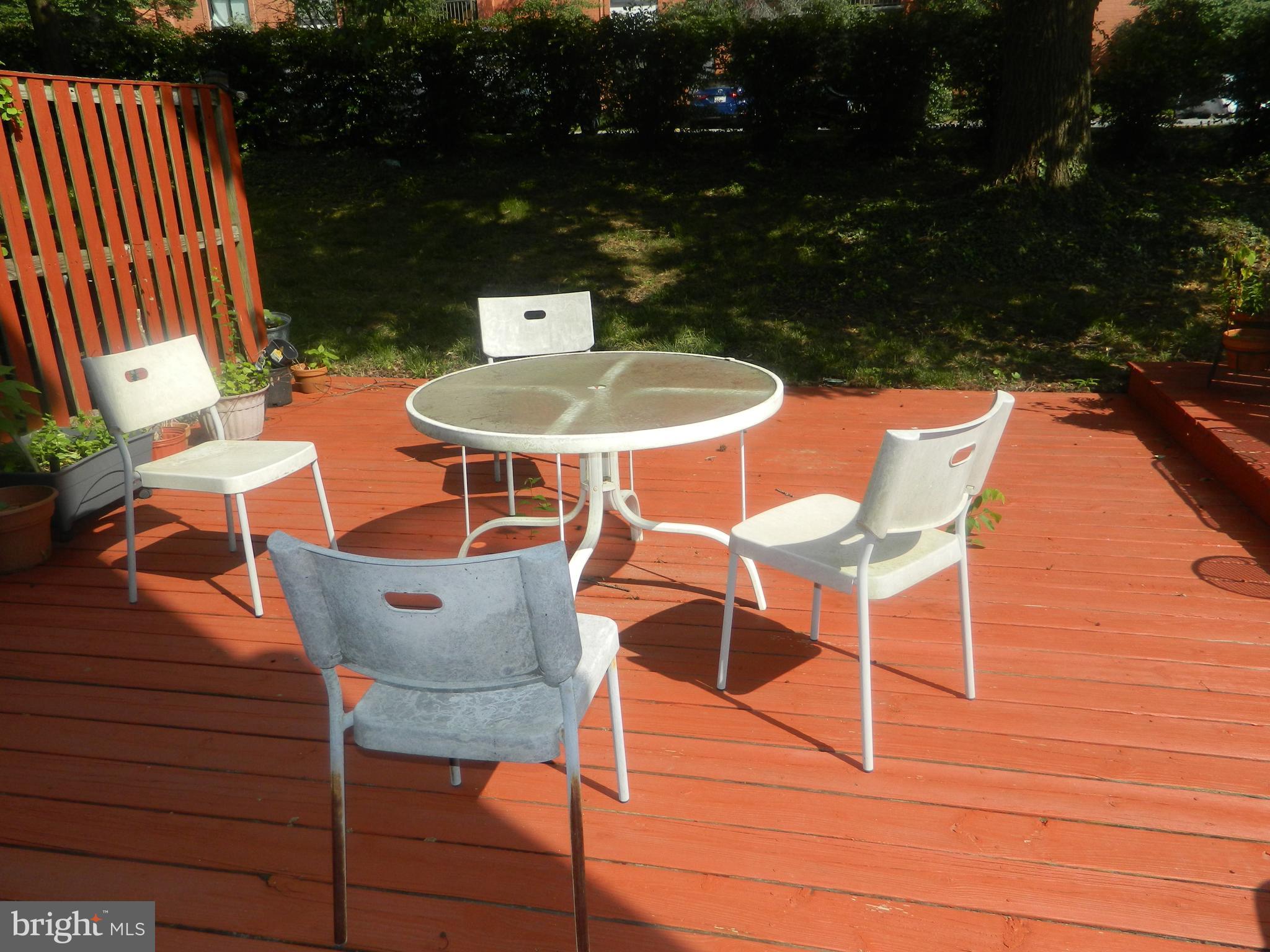 17 Theo Lane, Unit 17 Towson, MD 21204 - Photo 52 of 54 a patio with table and chairs and potted plants