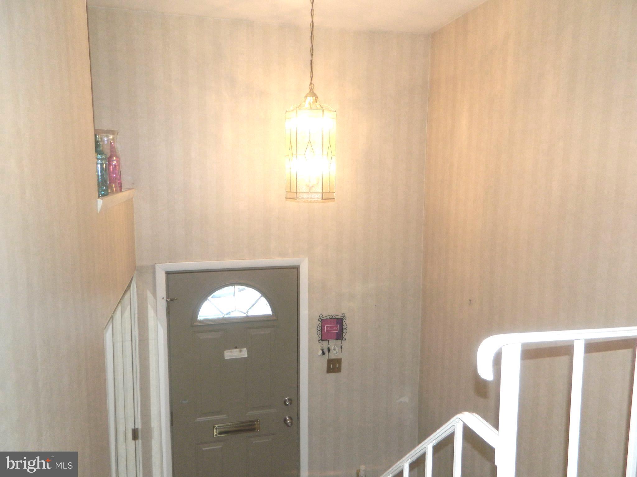 17 Theo Lane, Unit 17 Towson, MD 21204 - Photo 53 of 54 a bathroom with a light fixture and shower curtain