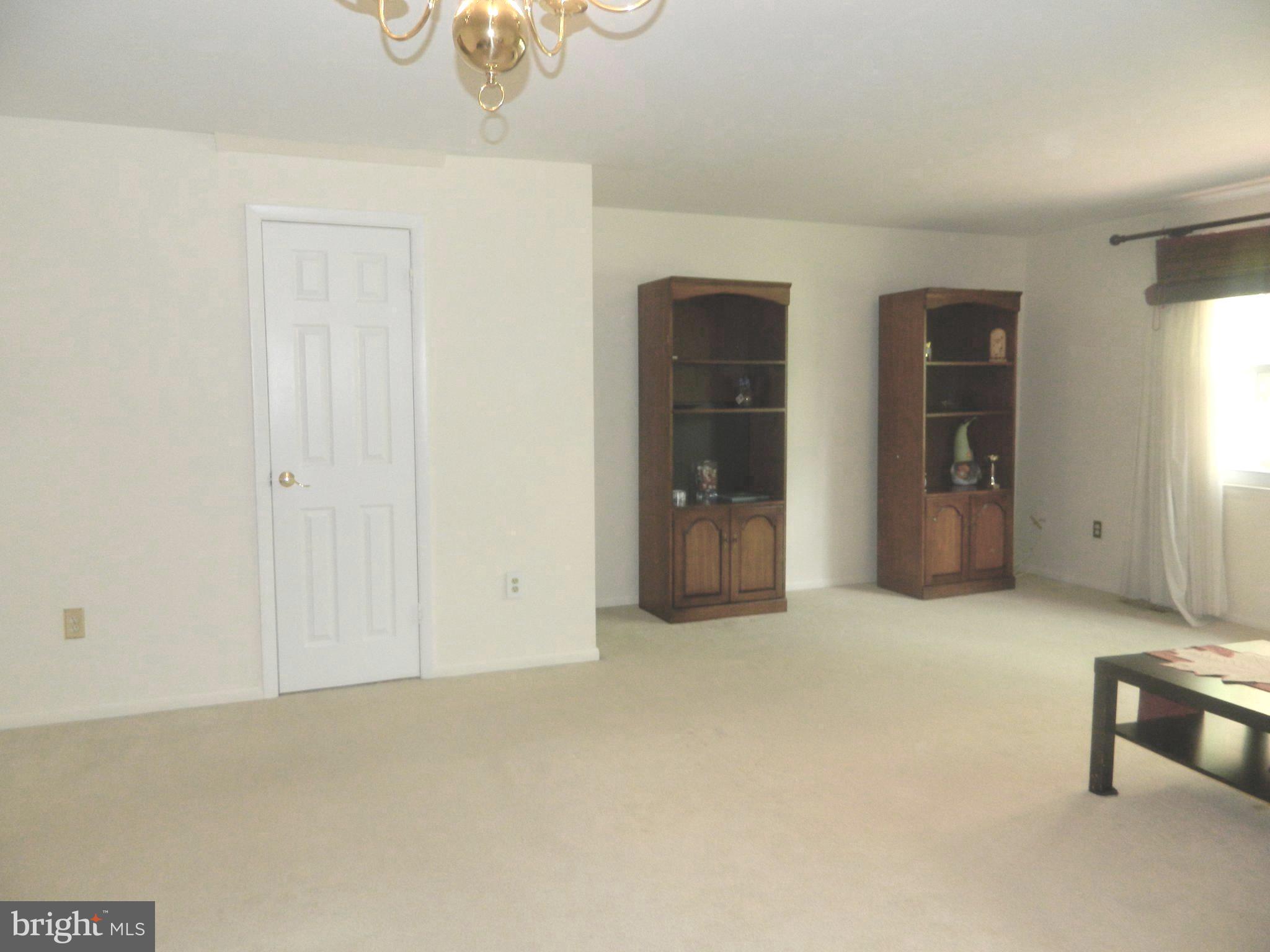 17 Theo Lane, Unit 17 Towson, MD 21204 - Photo 8 of 54 an empty room with closet and windows