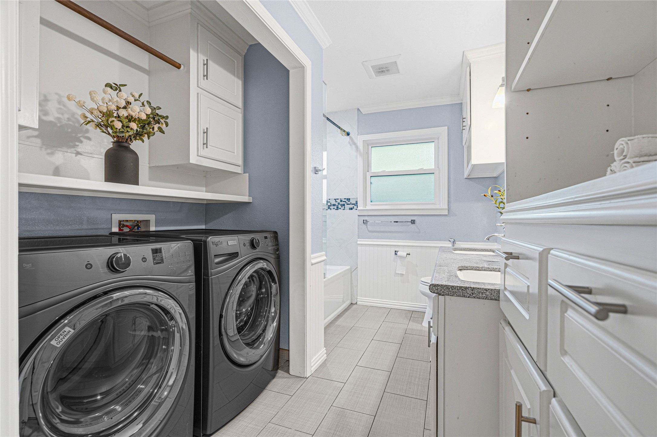 4002 Merrick Street Houston, TX 77025 - Photo 7 of 22 a view of a kitchen with sink dryer and washer