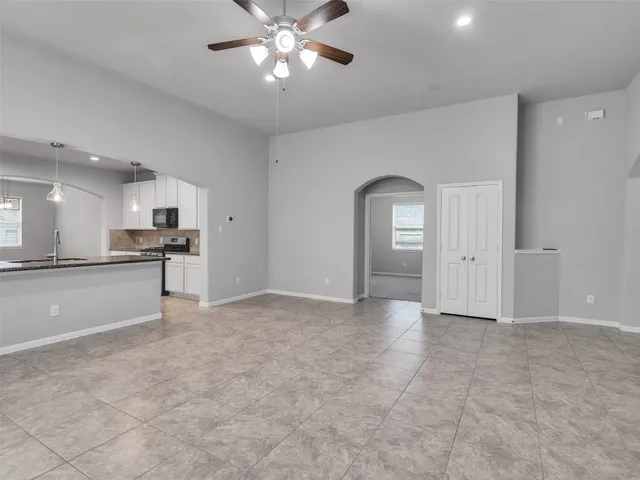 a view of a kitchen with a sink and cabinet area