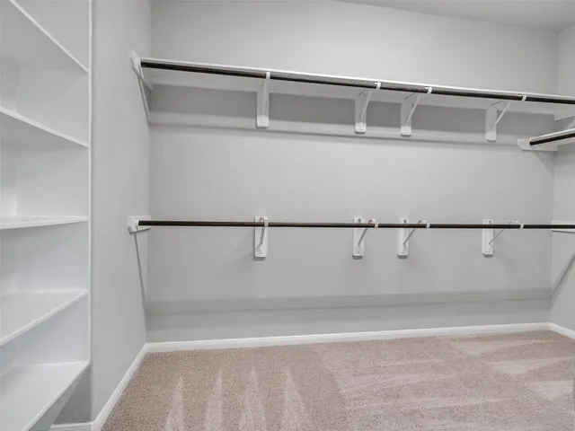 a spacious bathroom with a shower and a bathtub