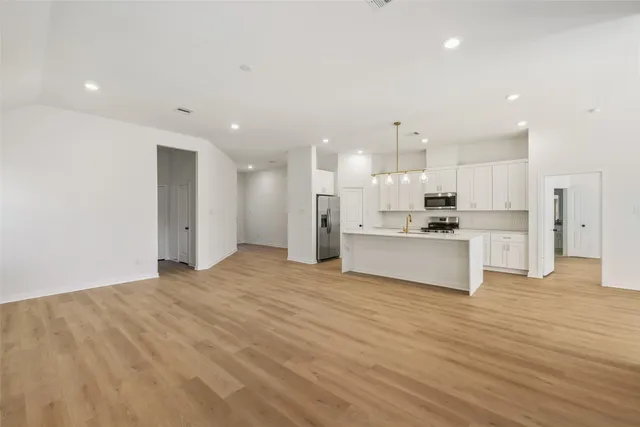 a view of kitchen with wooden floor