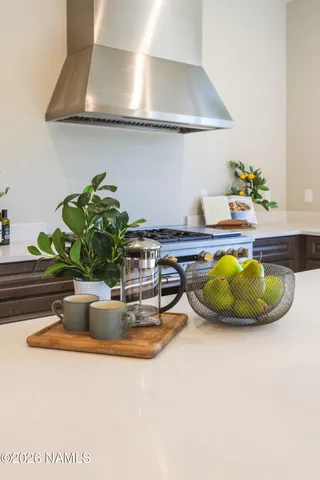 a kitchen with a stove and cabinets