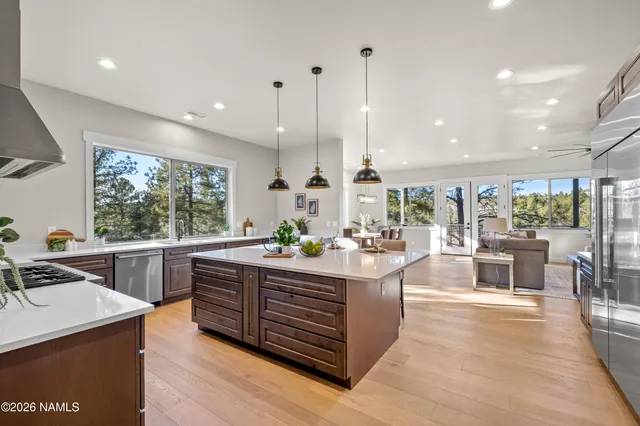 a kitchen with a sink appliances and a counter top space