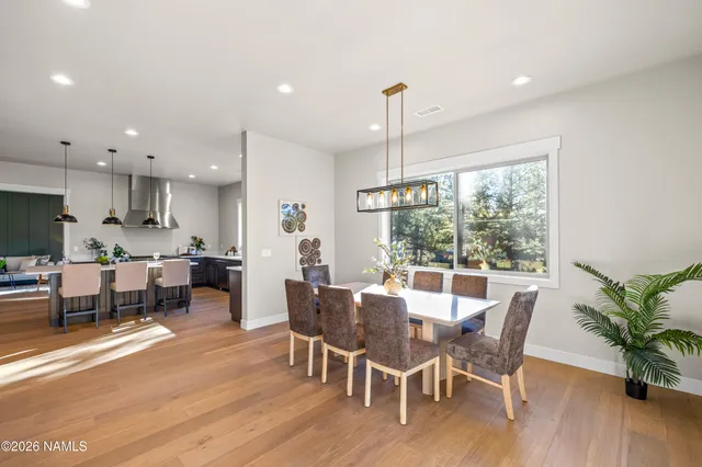 a kitchen with stainless steel appliances a refrigerator sink and microwave