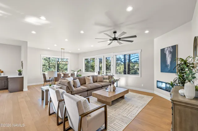 a living room with furniture and a table