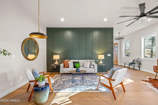 a living room with furniture and a rug