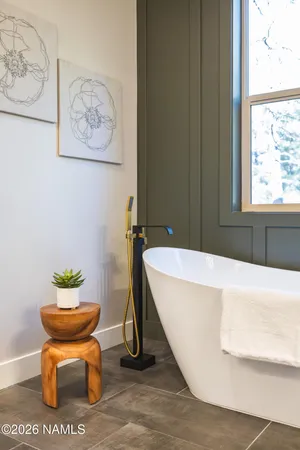 a view of balcony with wooden floor and fence