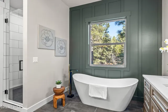 a bathroom with a glass shower door