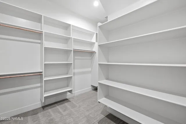 an empty room with a ceiling fan and a ceiling fan