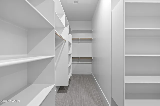 a view of balcony with wooden floor and fence