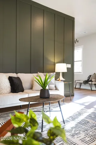 a kitchen with a stove and a potted plant