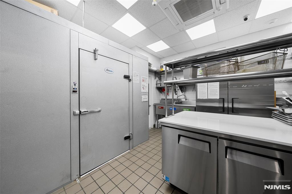 69-71 Ridgefield Avenue Ridgefield Park, NJ 07660 - Photo 16 of 37 a kitchen with a sink and a refrigerator