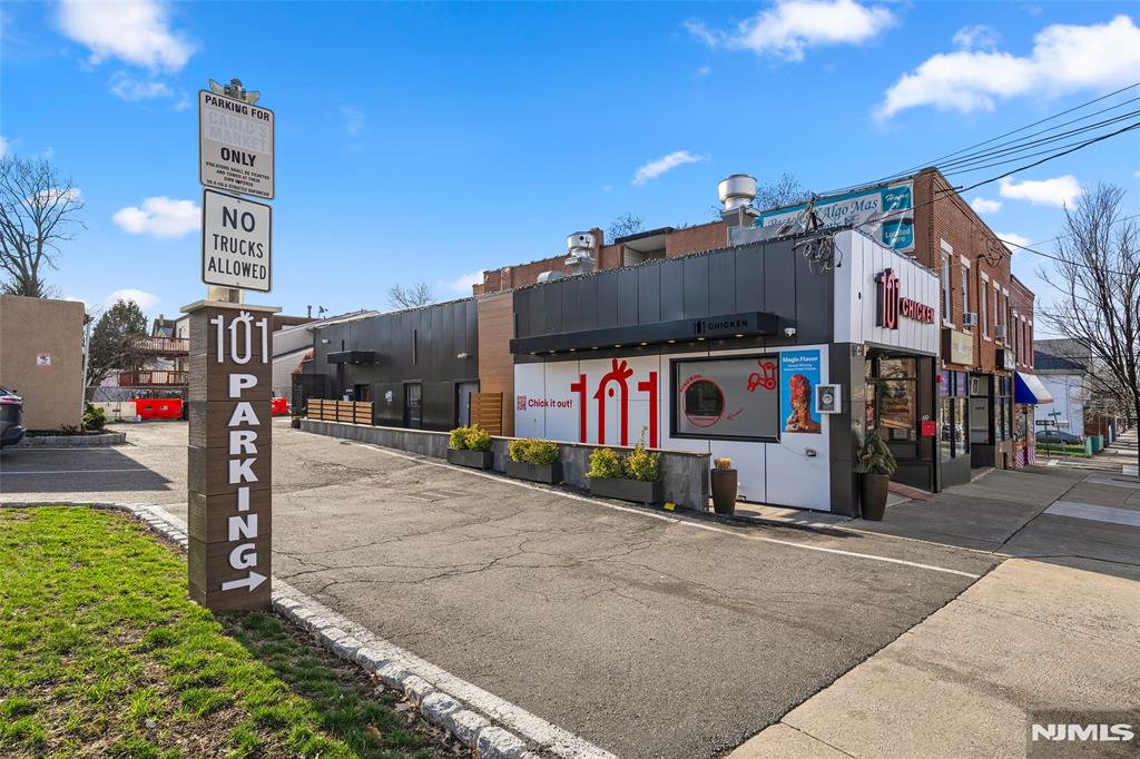 69-71 Ridgefield Avenue Ridgefield Park, NJ 07660 - Photo 2 of 37 a street sign on a sidewalk next to a building