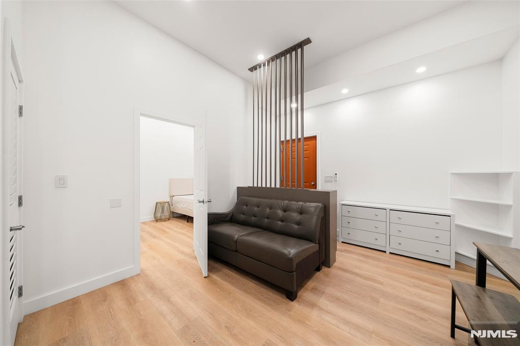 69-71 Ridgefield Avenue Ridgefield Park, NJ 07660 - Photo 24 of 37 a living room with furniture and a wooden floor