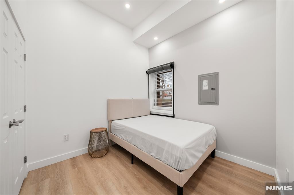 69-71 Ridgefield Avenue Ridgefield Park, NJ 07660 - Photo 25 of 37 a bedroom with a bed and a window