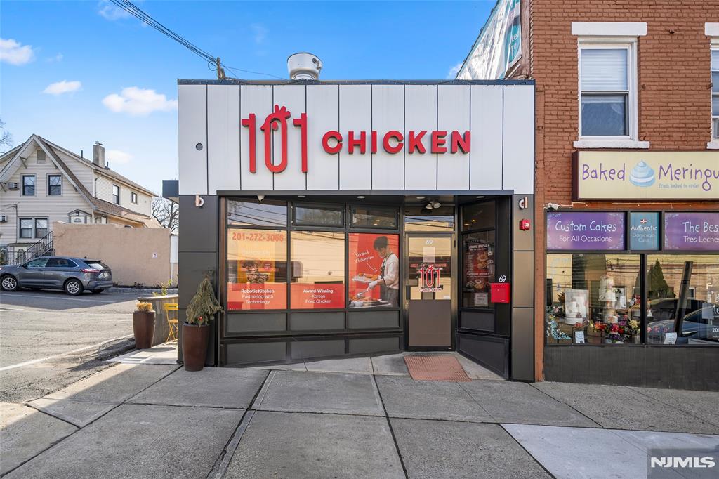 69-71 Ridgefield Avenue Ridgefield Park, NJ 07660 - Photo 4 of 37 a sign on the side of a street