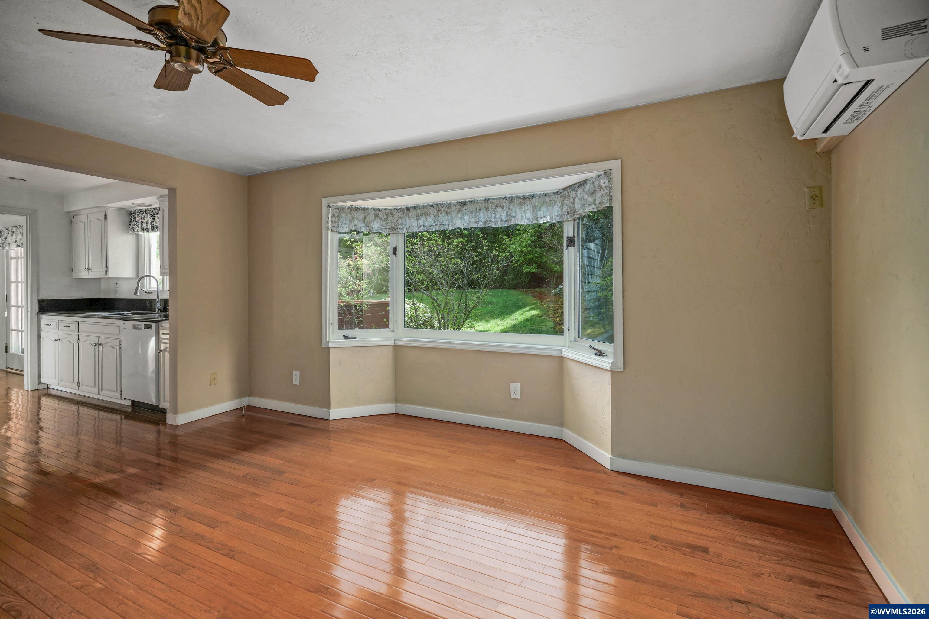 220 Northwest Downy Drive Sublimity, OR 97385 - Photo 11 of 47 a view of livingroom with hardwood floor and window