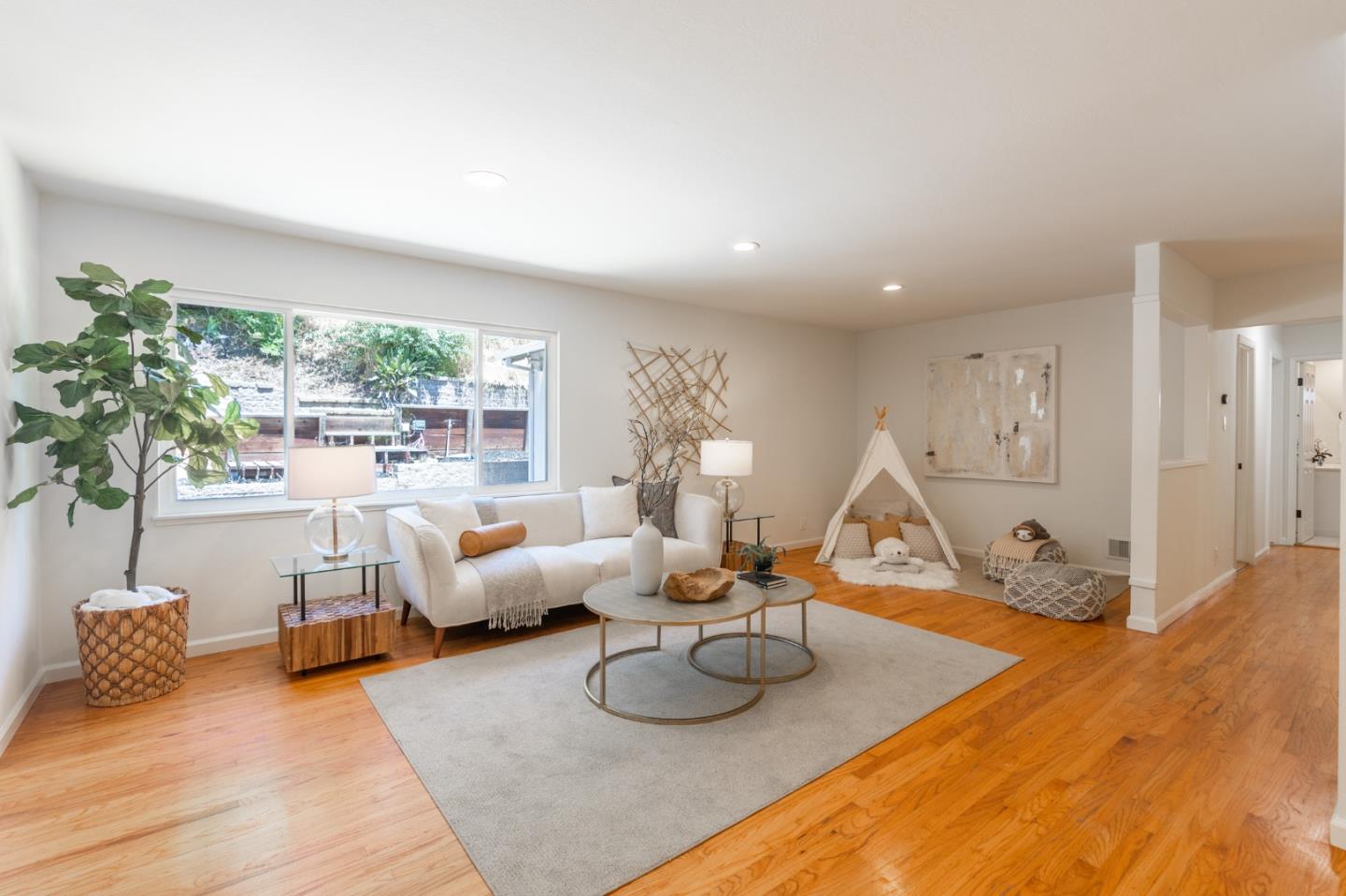 30432 Treeview Street Hayward, CA 94544 - Photo 11 of 35 a living room with furniture and a large window
