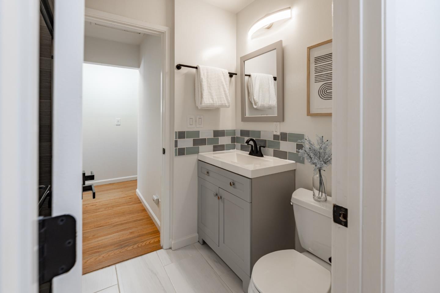 30432 Treeview Street Hayward, CA 94544 - Photo 13 of 35 a bathroom with a sink a toilet a mirror and vanity