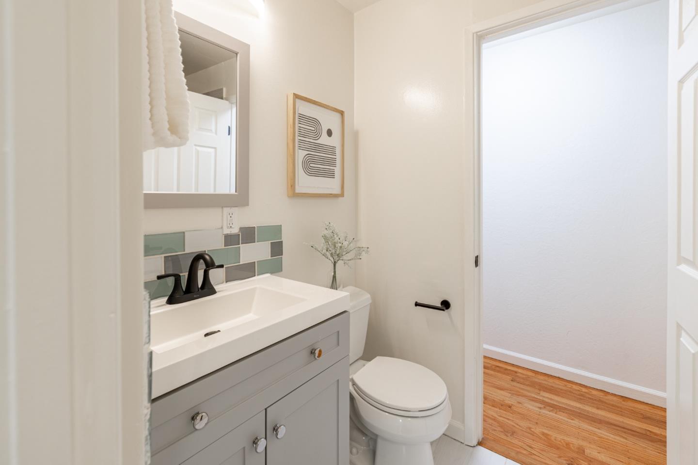 30432 Treeview Street Hayward, CA 94544 - Photo 22 of 35 a bathroom with a sink toilet and a mirror