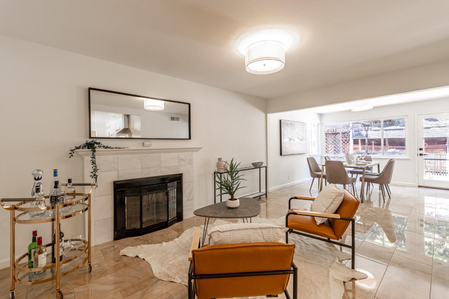 30432 Treeview Street Hayward, CA 94544 - Photo 3 of 35 a living room with furniture a fireplace and a table