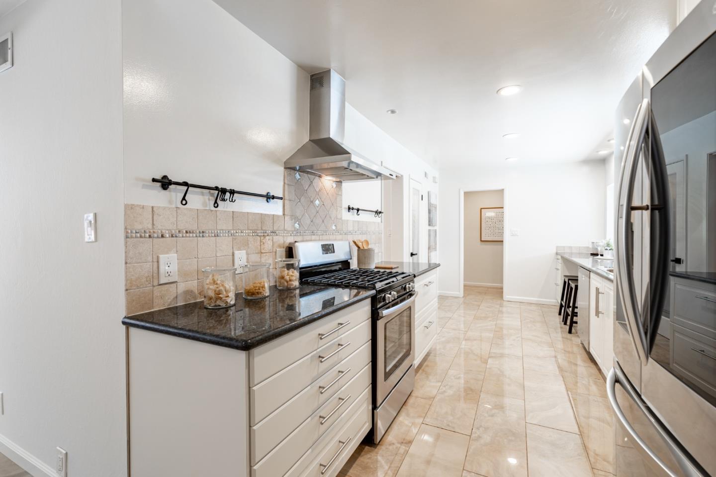 30432 Treeview Street Hayward, CA 94544 - Photo 7 of 35 a kitchen with stainless steel appliances a sink stove and refrigerator