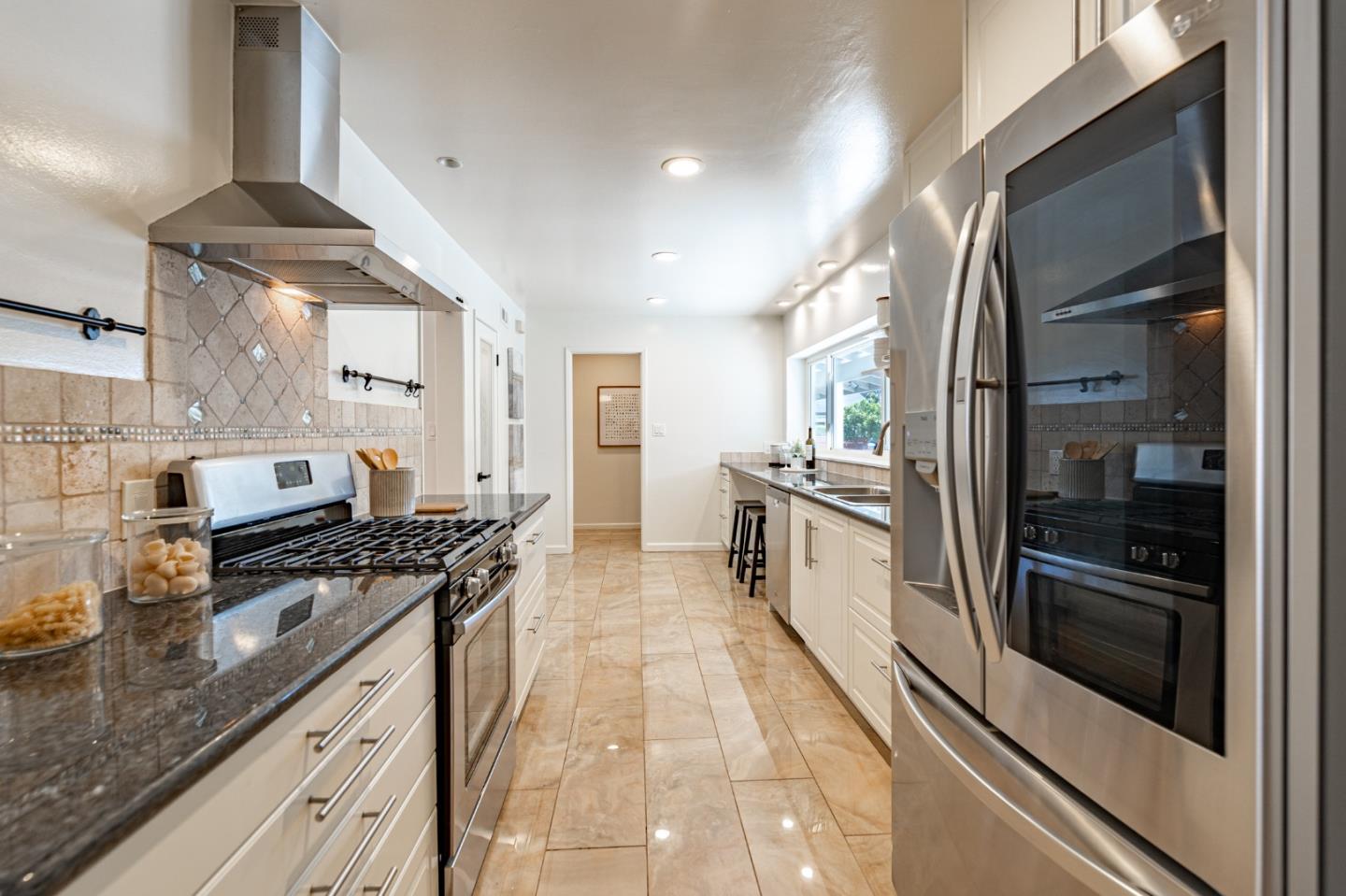 30432 Treeview Street Hayward, CA 94544 - Photo 8 of 35 a kitchen with stainless steel appliances granite countertop a stove and a sink