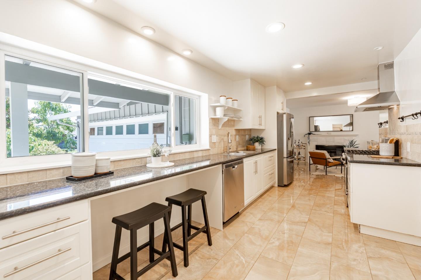 30432 Treeview Street Hayward, CA 94544 - Photo 9 of 35 a kitchen with stainless steel appliances granite countertop a sink and a refrigerator