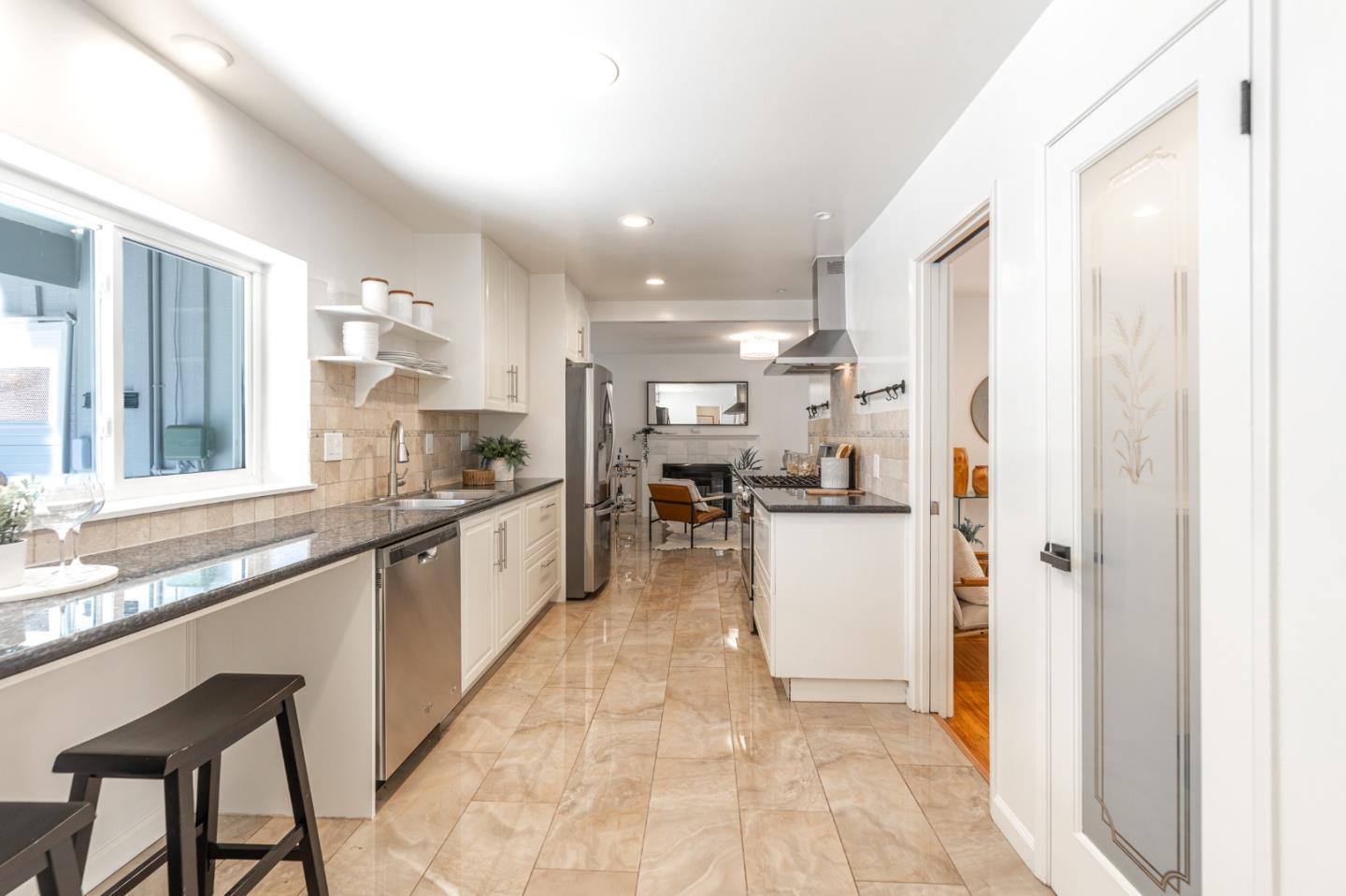 30432 Treeview Street Hayward, CA 94544 - Photo 10 of 35 a large white kitchen with refrigerator and a sink