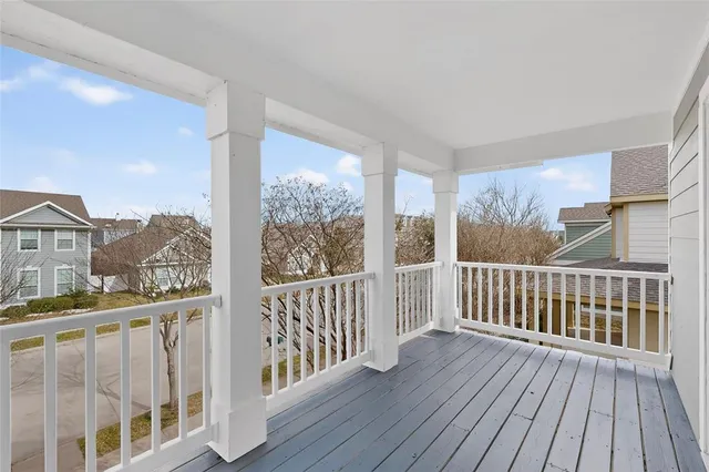 a view of a porch with wooden floor
