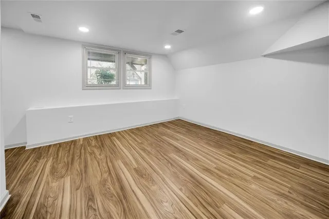 a living room with furniture a window and a chandelier