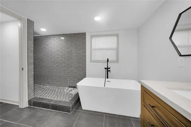 a bathroom with a toilet and a bathtub