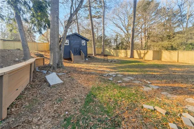 a house view with a backyard space