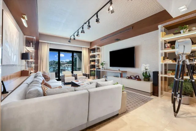 a bedroom with furniture and a flat screen tv