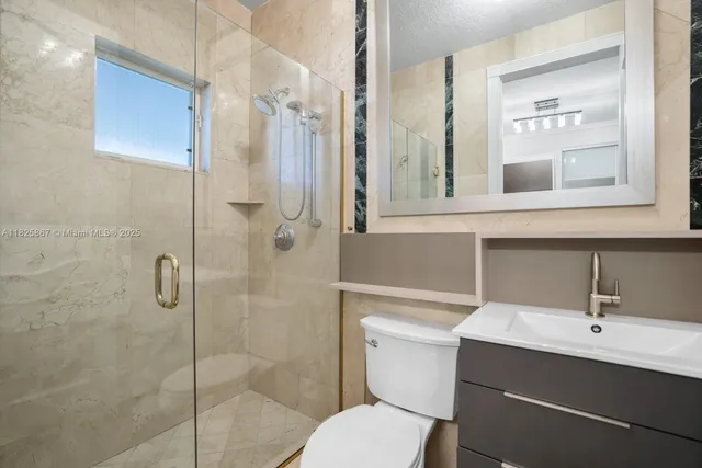 a view of a living room and kitchen