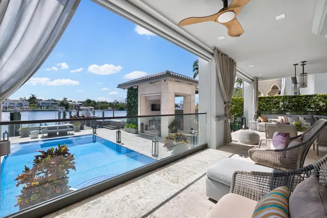 a front view of a house with yard and tree s