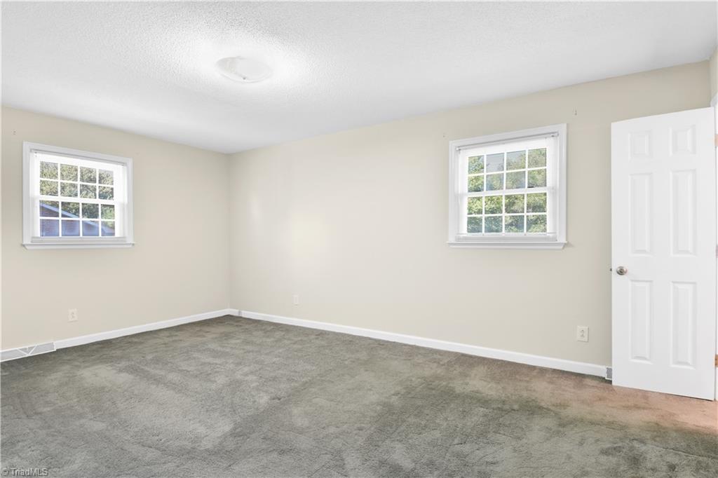 546 Drumheller Road Clemmons, NC 27012 - Photo 16 of 29 Large primary bedroom features walk-in closet.