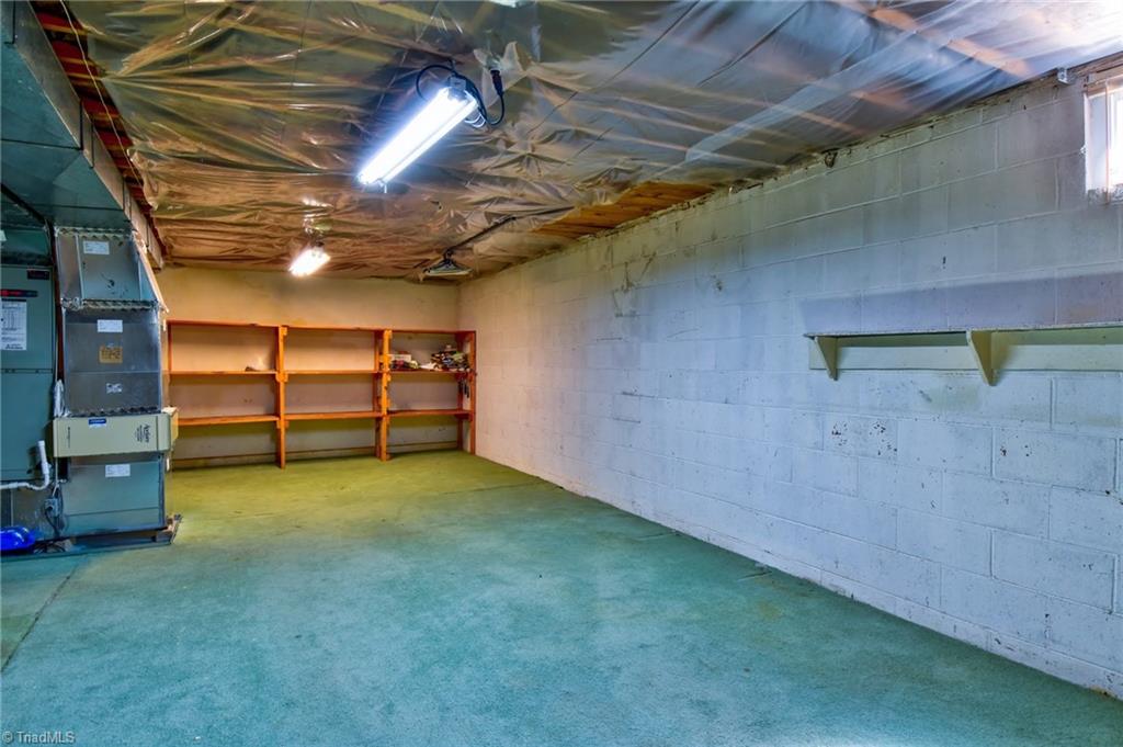 546 Drumheller Road Clemmons, NC 27012 - Photo 24 of 29 400+ sf unfinished workshop/storage.