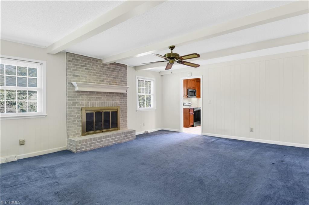 546 Drumheller Road Clemmons, NC 27012 - Photo 10 of 29 Oversized den with gas log masonry fireplace.