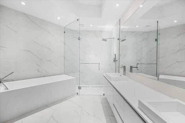 a bathroom with a bathtub and a sink