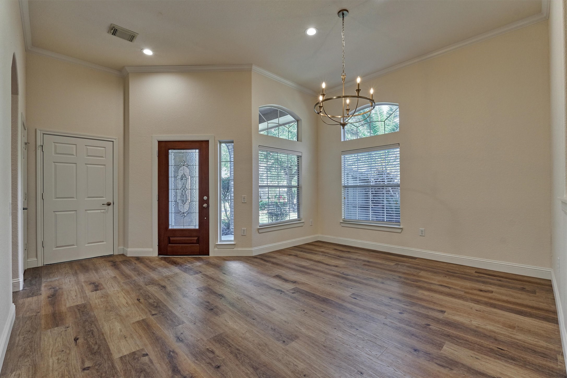 6 Windsor Bridge Drive Conroe, TX 77384 - Photo 12 of 46 wooden floor in an empty room with a window