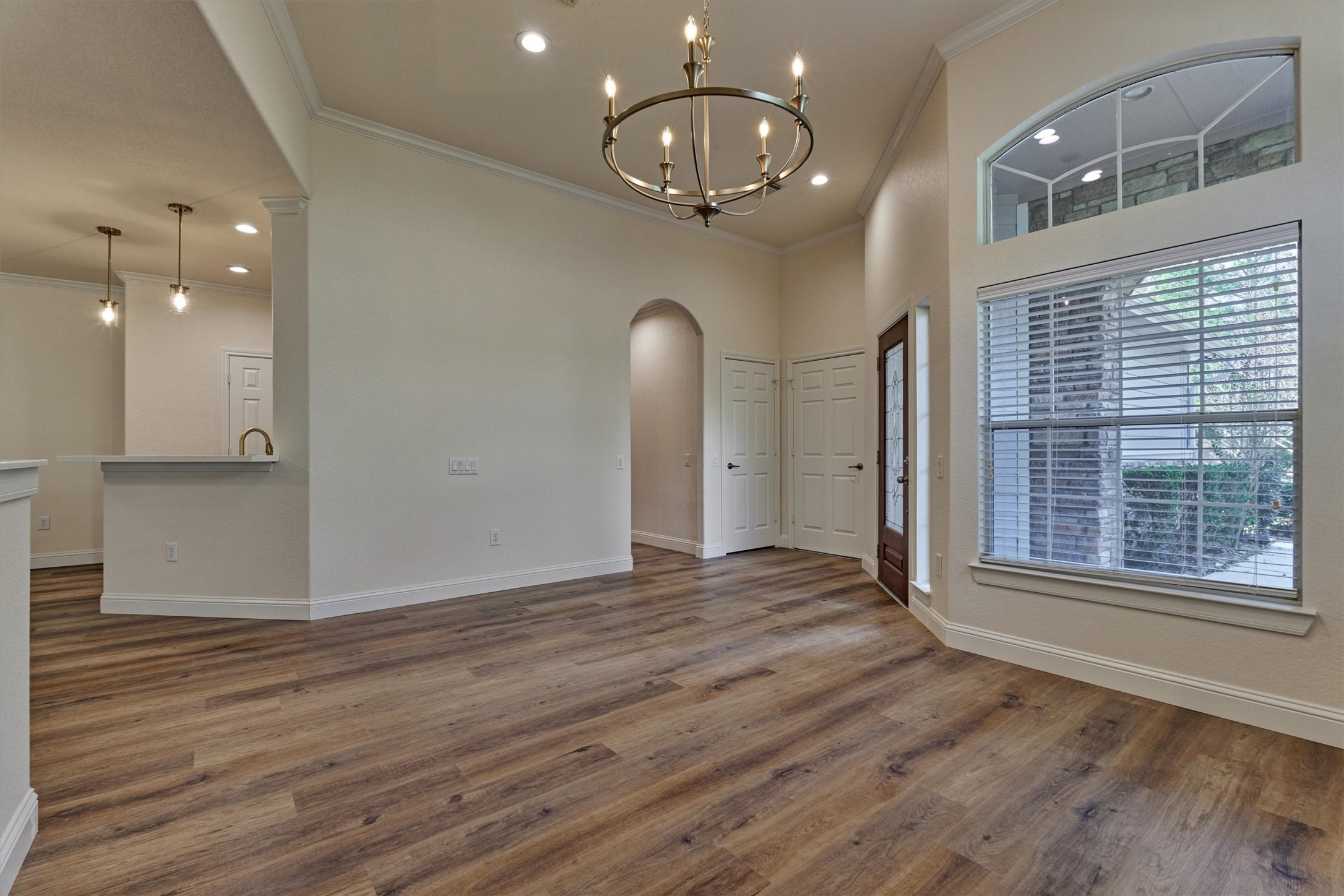6 Windsor Bridge Drive Conroe, TX 77384 - Photo 14 of 46 a view of empty room with wooden floor and window
