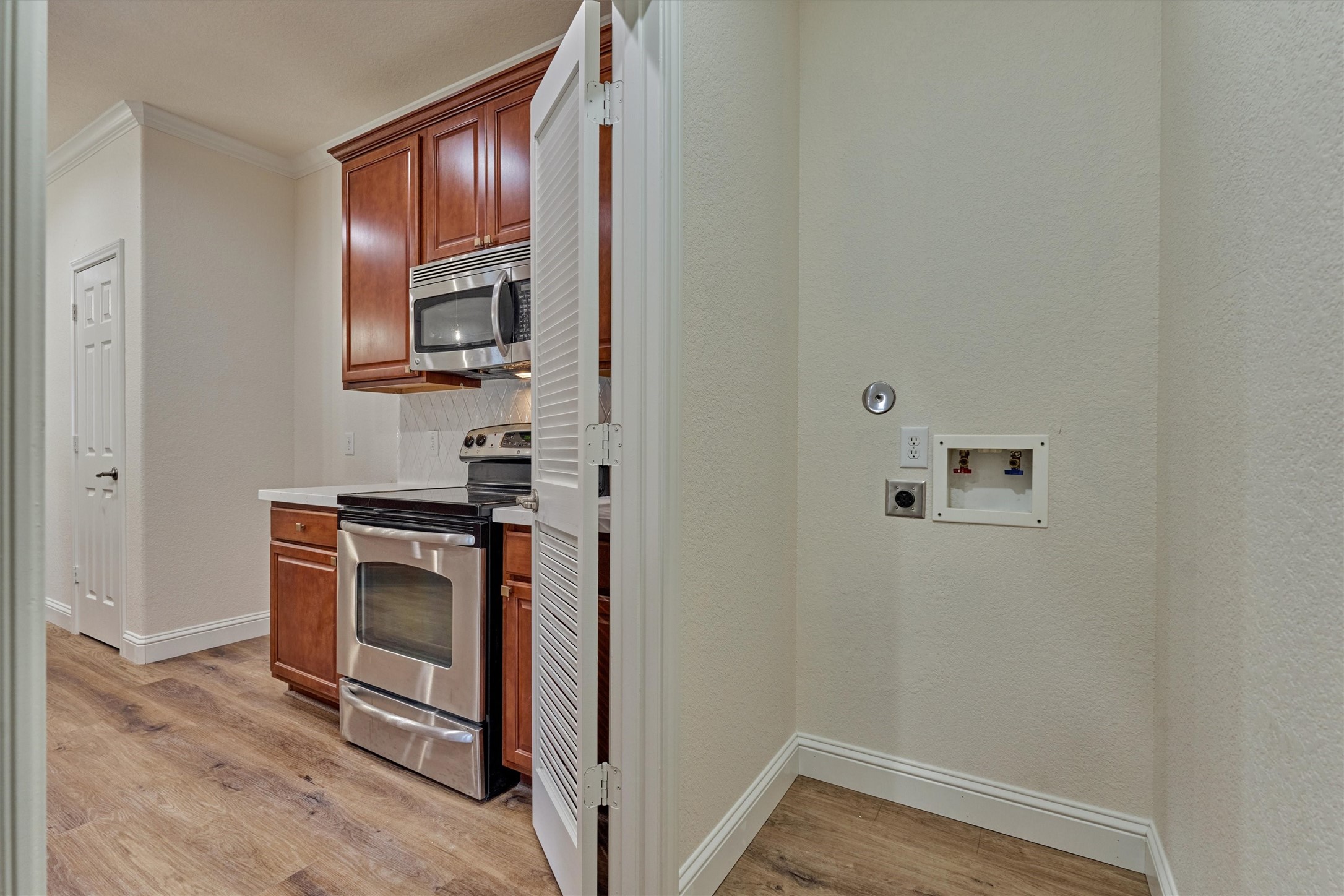 6 Windsor Bridge Drive Conroe, TX 77384 - Photo 19 of 46 a view of kitchen with sink and stainless steel appliances
