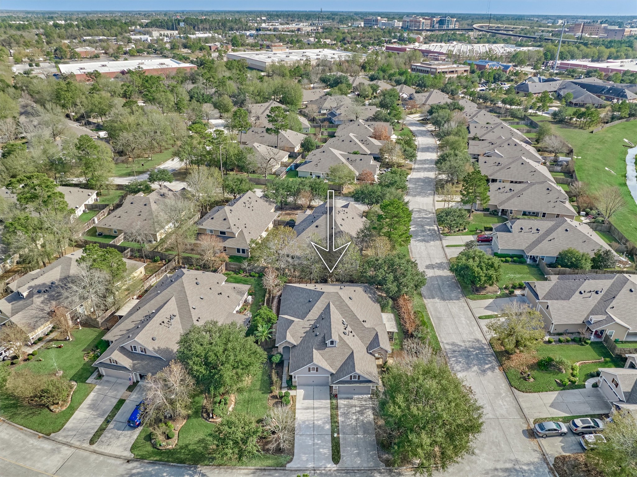 6 Windsor Bridge Drive Conroe, TX 77384 - Photo 2 of 46 an aerial view of residential houses with outdoor space